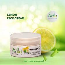 Jar of avila lemon face cream with a lemon slice and green leaves on a bright, refreshing background.