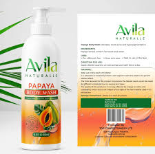 Bottle of avila naturalle papaya body wash with ingredients and product information displayed against a white background with green plant accents.