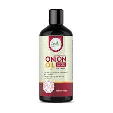 Bottle of onion oil for hair treatment.