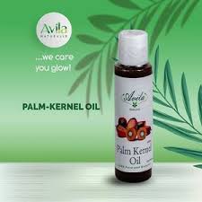 Bottle of palm kernel oil with brand logo, placed against a green background with palm illustrations and the slogan "we care you glow!.