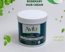 A jar of avila organic rosemary hair cream with green labels, surrounded by leaves, on a white background.