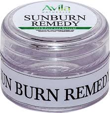 A jar of avila sunburn remedy cream with a clear lid and labeled in white and green.