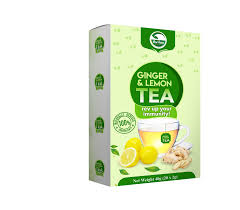 A box of ginger and lemon tea featuring images of ginger, lemon slices, and a cup of tea, with green and white packaging that highlights its organic nature.