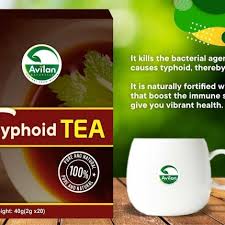 Image of a boxed product called "Typhoid Tea" from Avilan brand, next to a white cup with the Avilan logo. Text beside the box highlights the tea's benefits in fighting typhoid and boosting immune health.